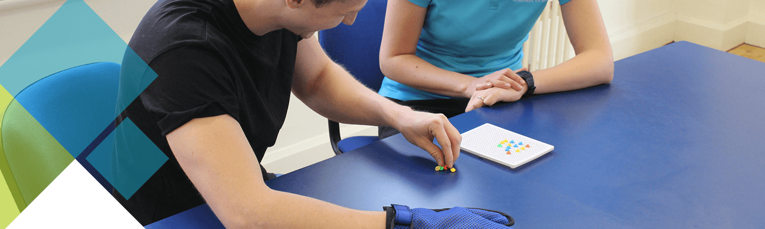 CIMT patient testing out a dexterity challenge