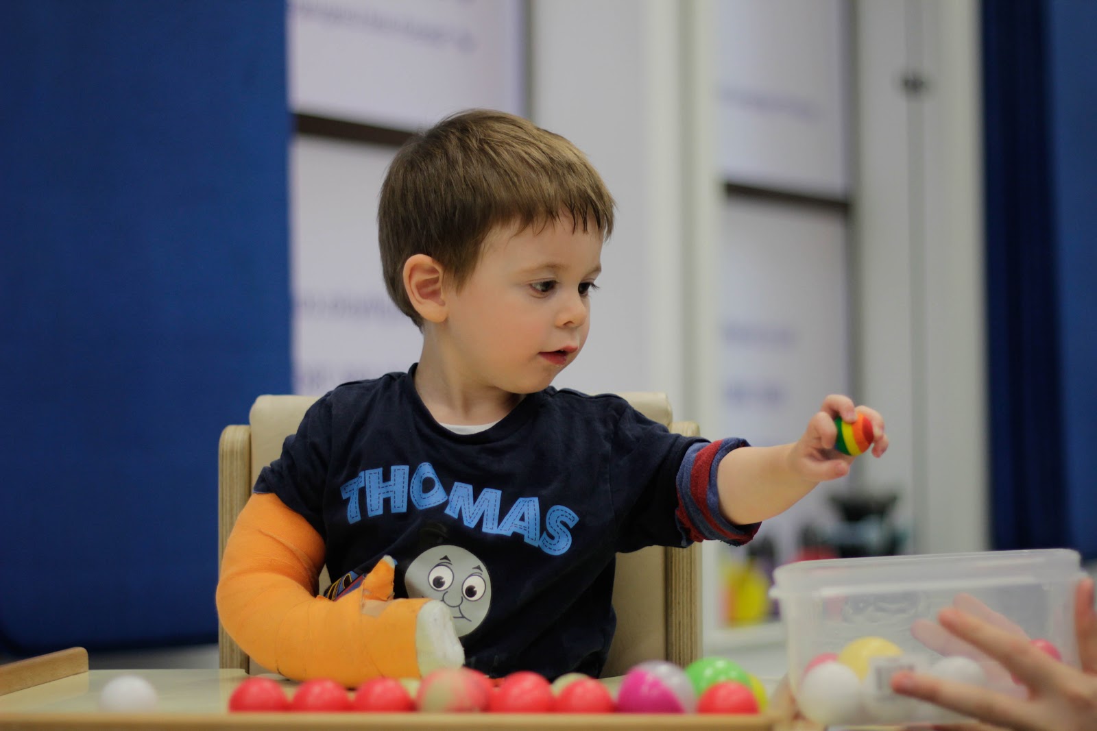 Thomas interacting with CIMT therapist