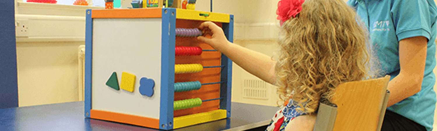 Child playing with an abacus