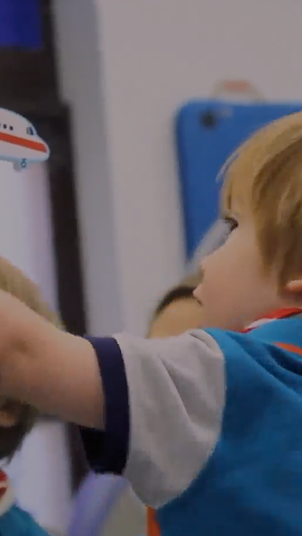 Alistair drawing on a whiteboard during his CIMT session