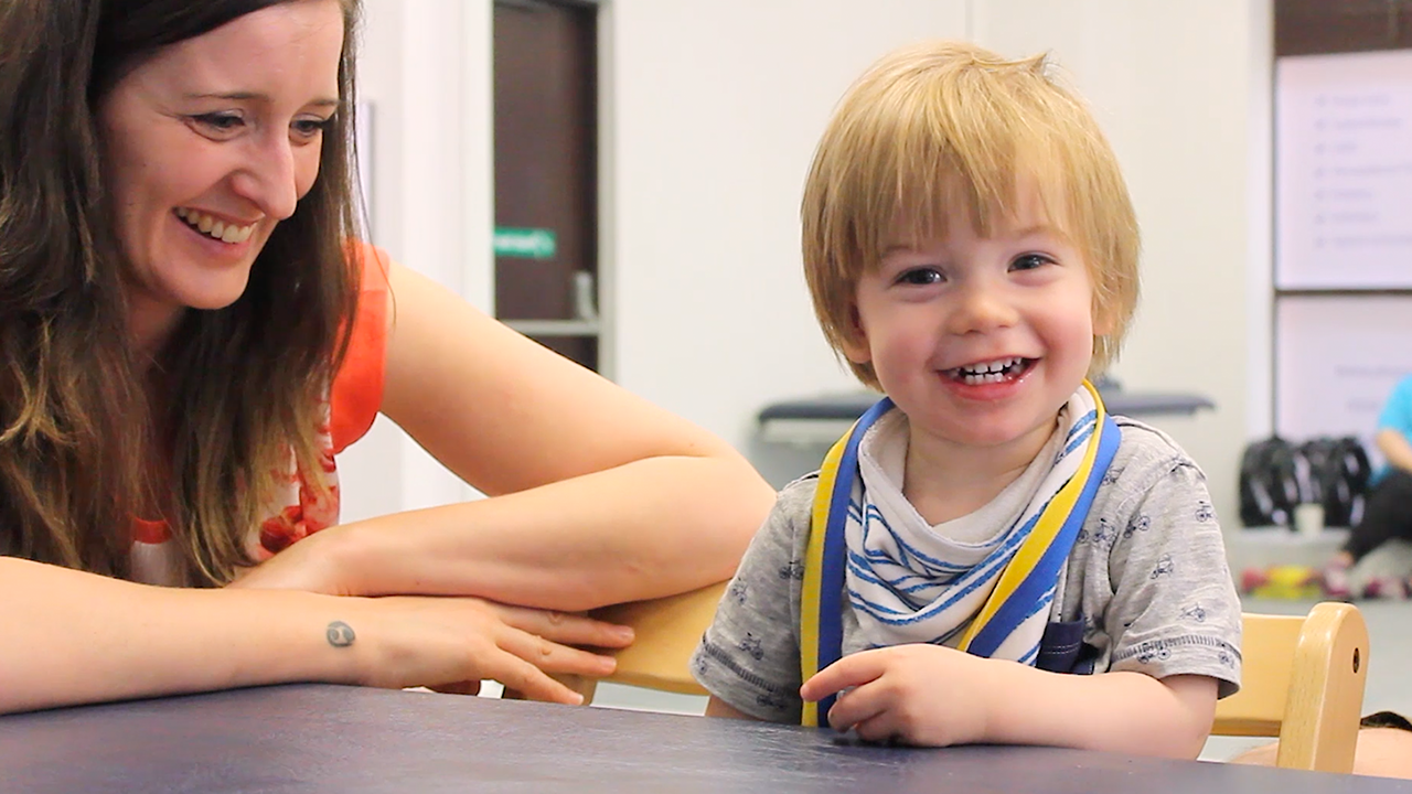 Alistair smiling with his mum.