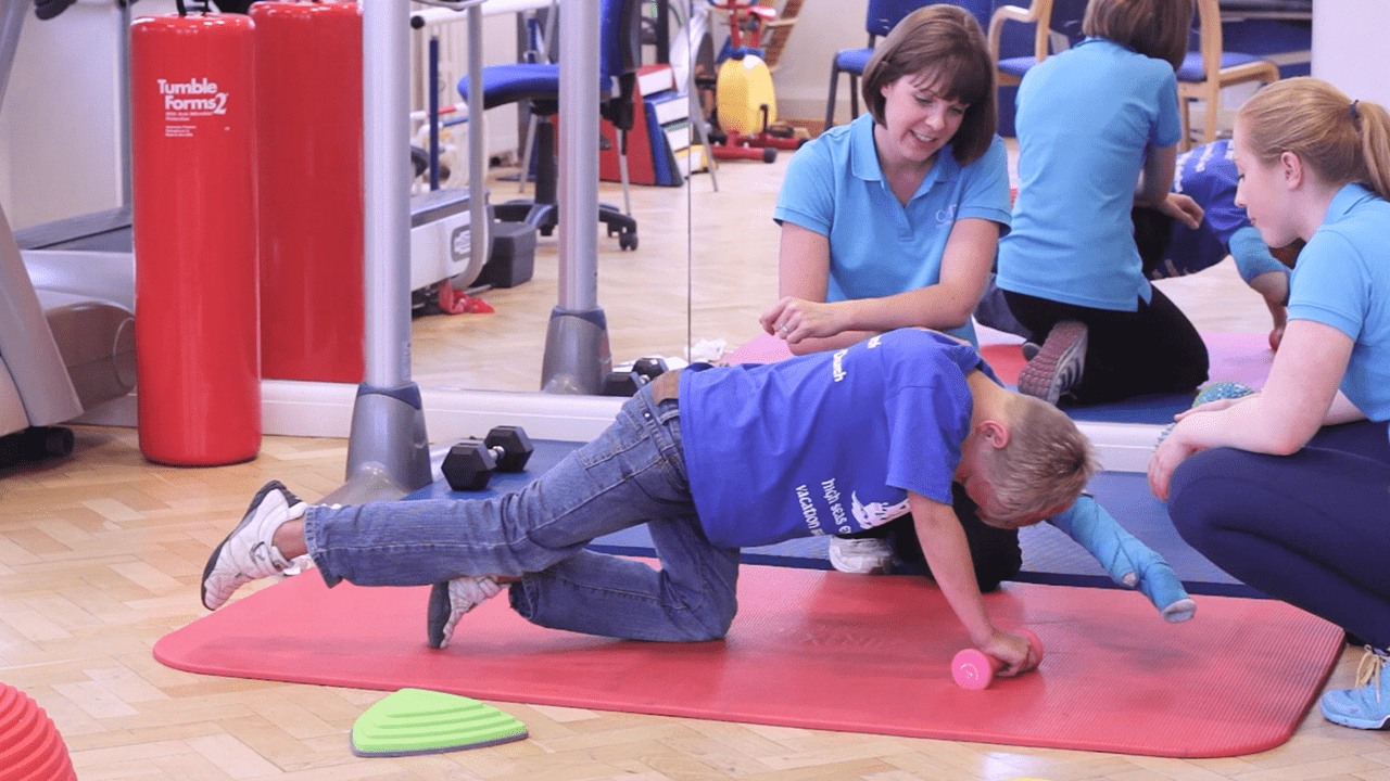 Caleb exercising using weights.