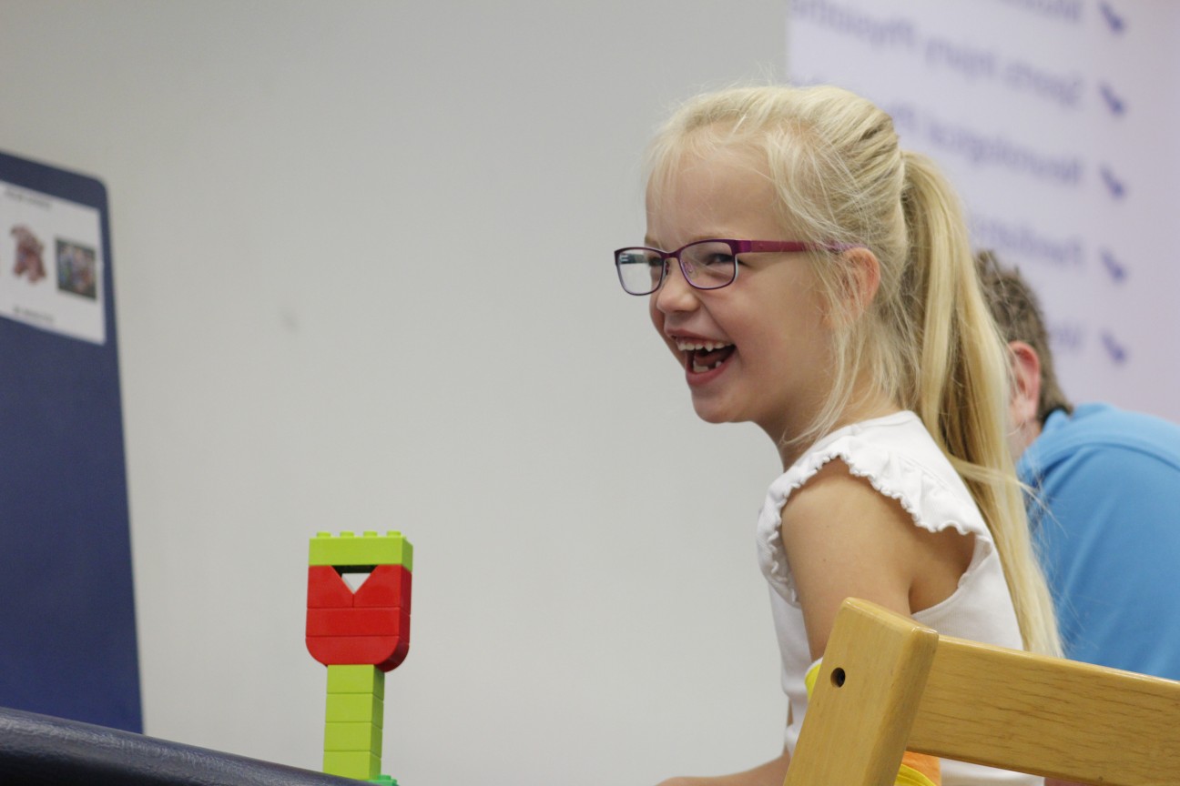 Darcie playing with toys during CIMT treatment