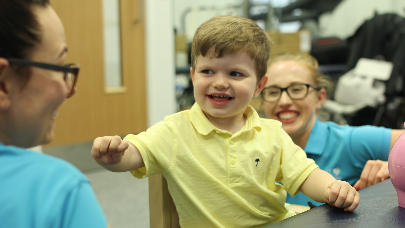 Finlay listening to CIMT therapist.