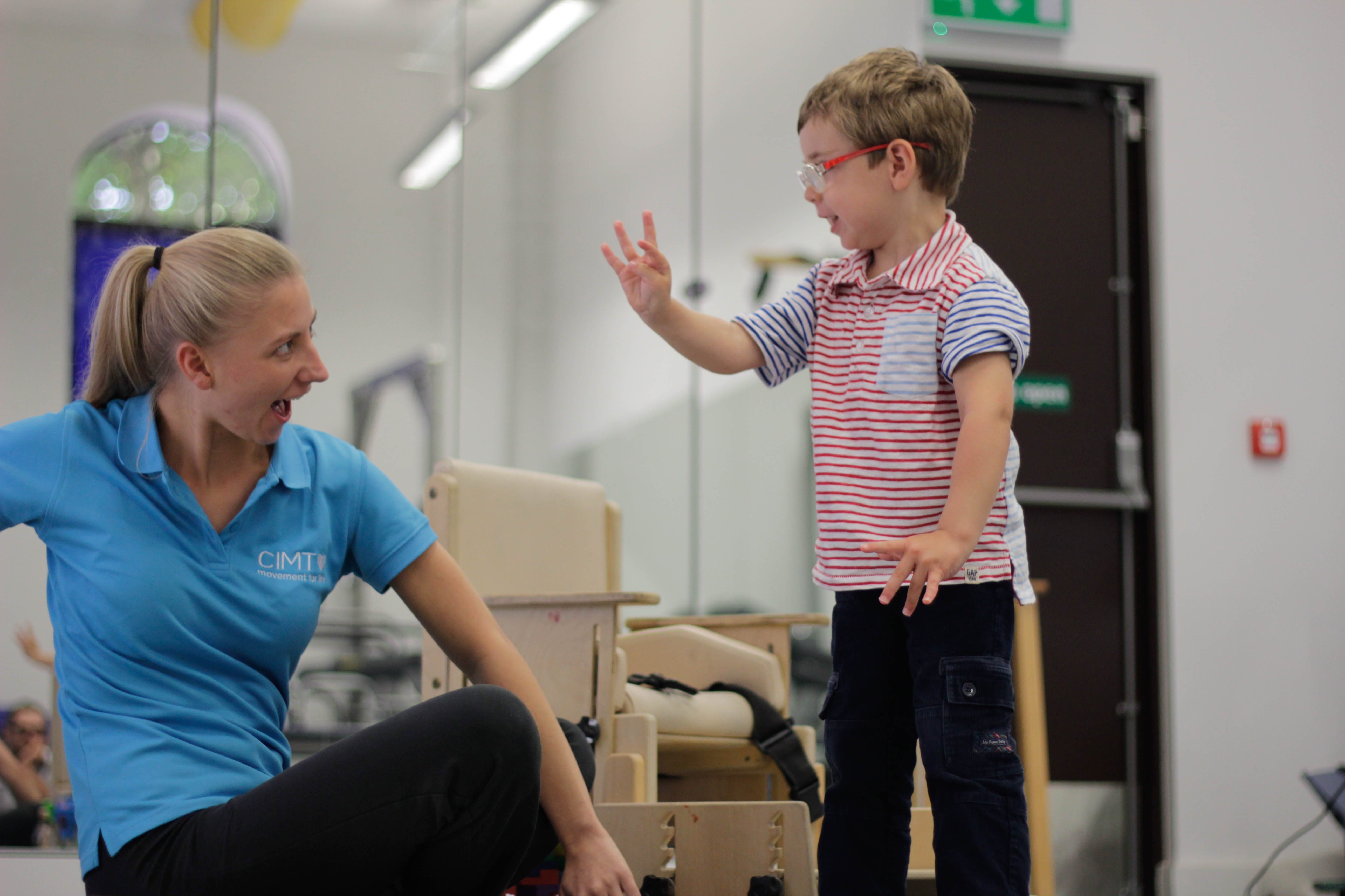 George guided by CIMT therapist during treatment.