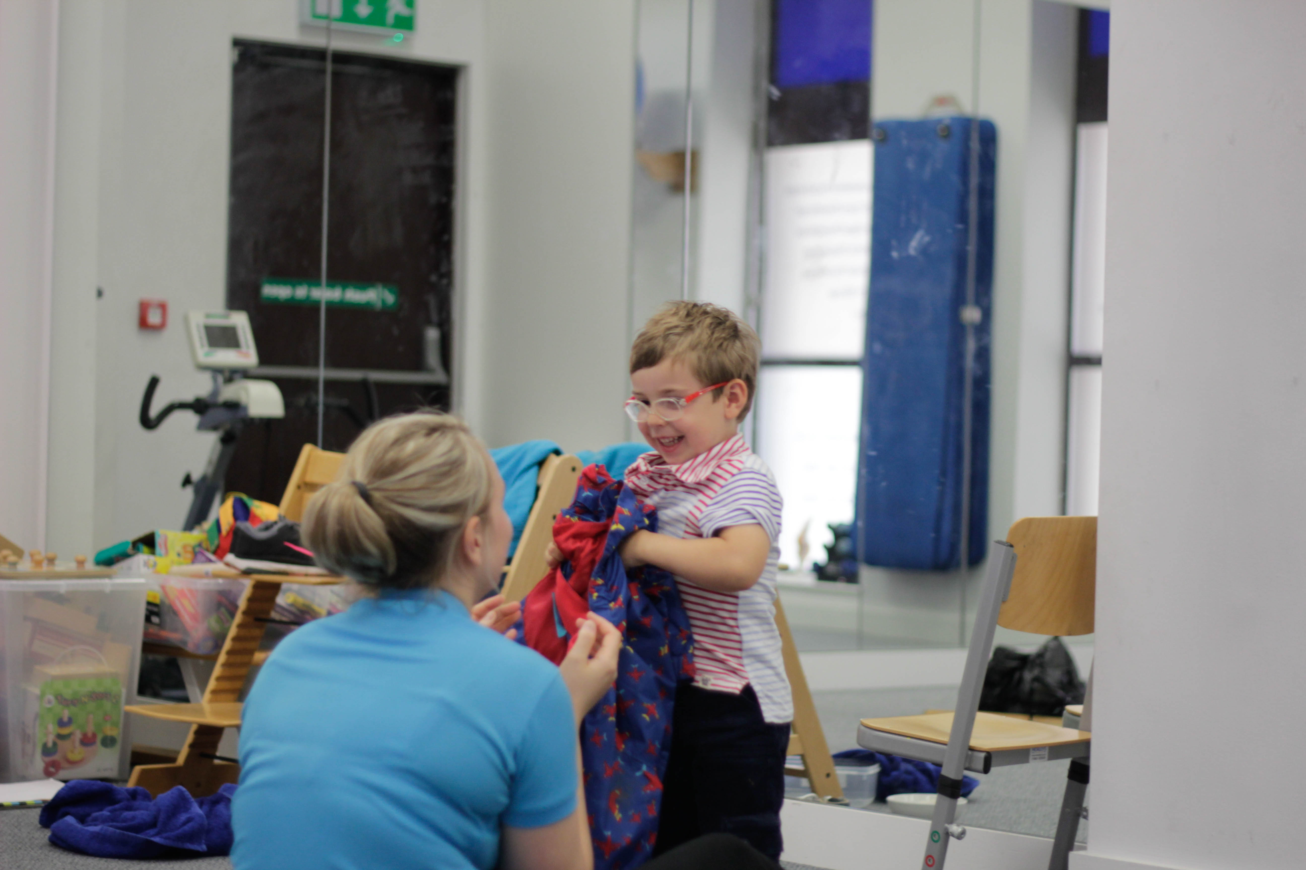 George giving coat to CIMT therapist