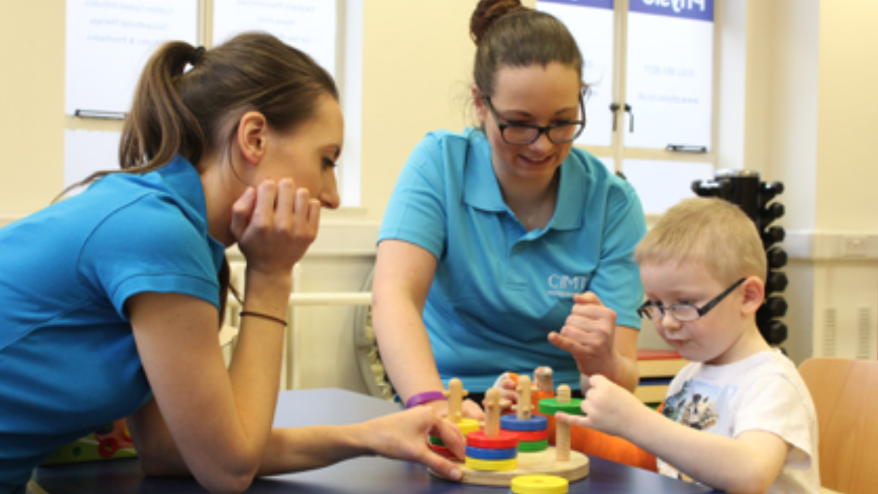 Harry playing with colourful blocks.