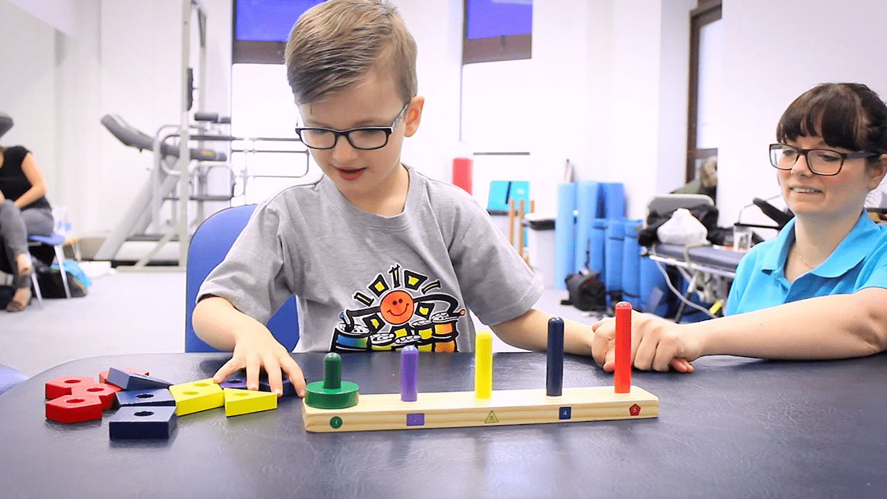 Jude playing with blocks during treatment.