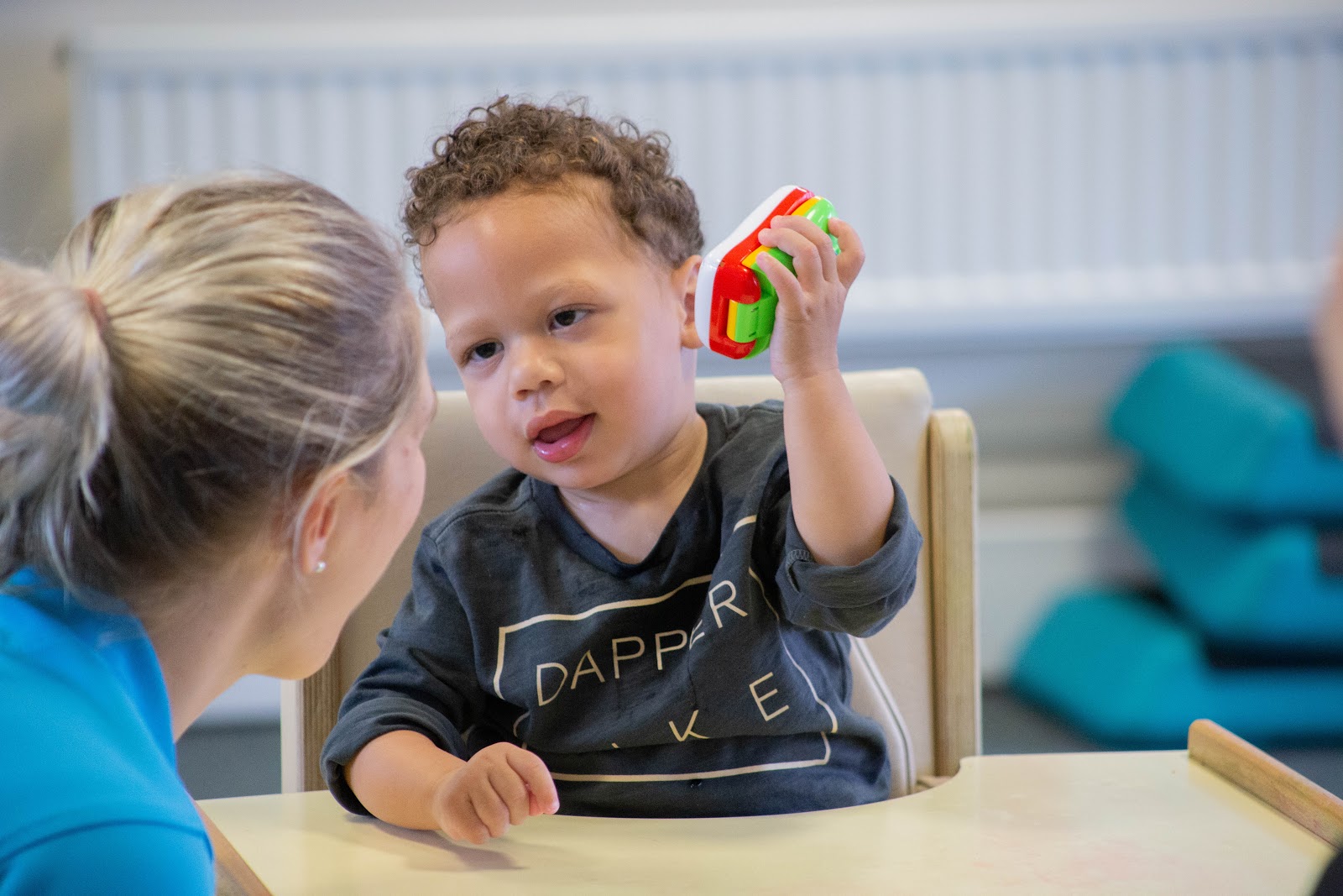 Alistair playing with toys during treatment at CIMT