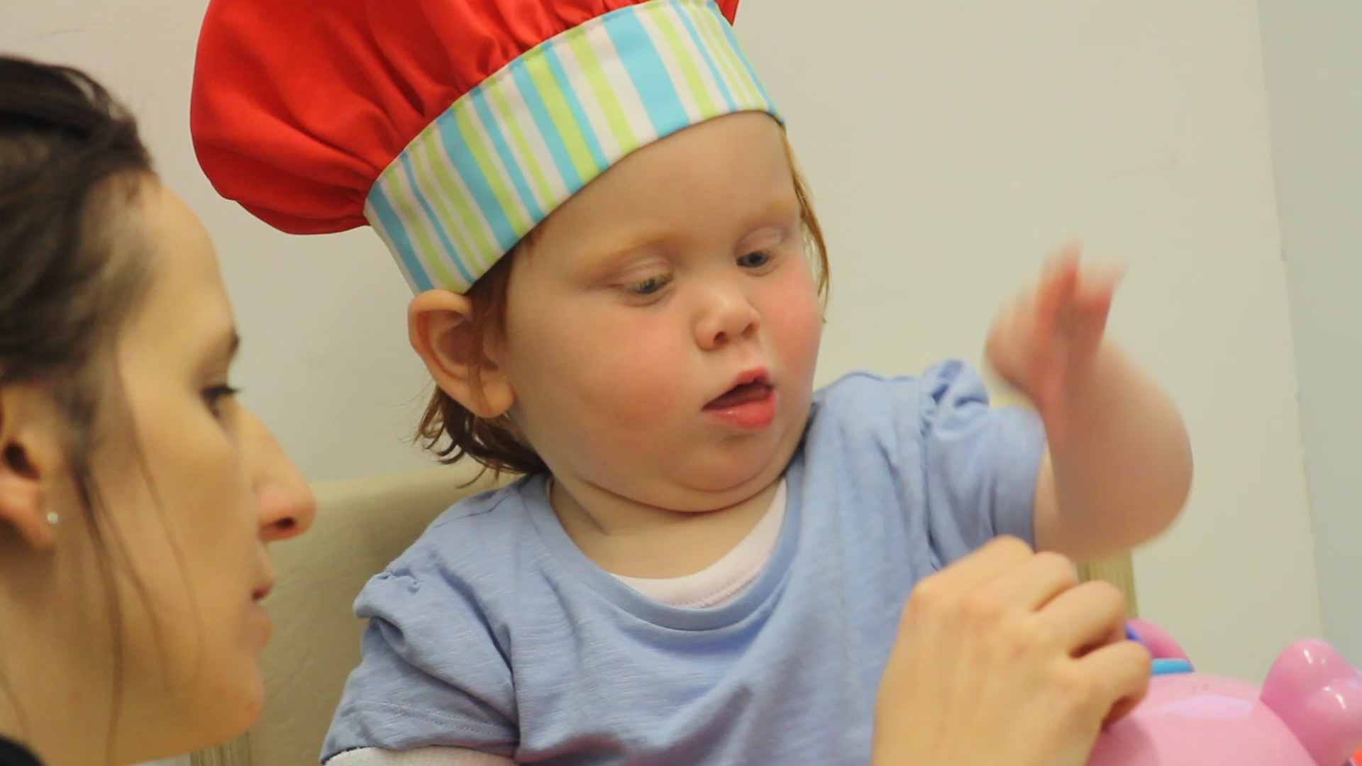 Therapists playing with Kathryn while dressed as a chef.