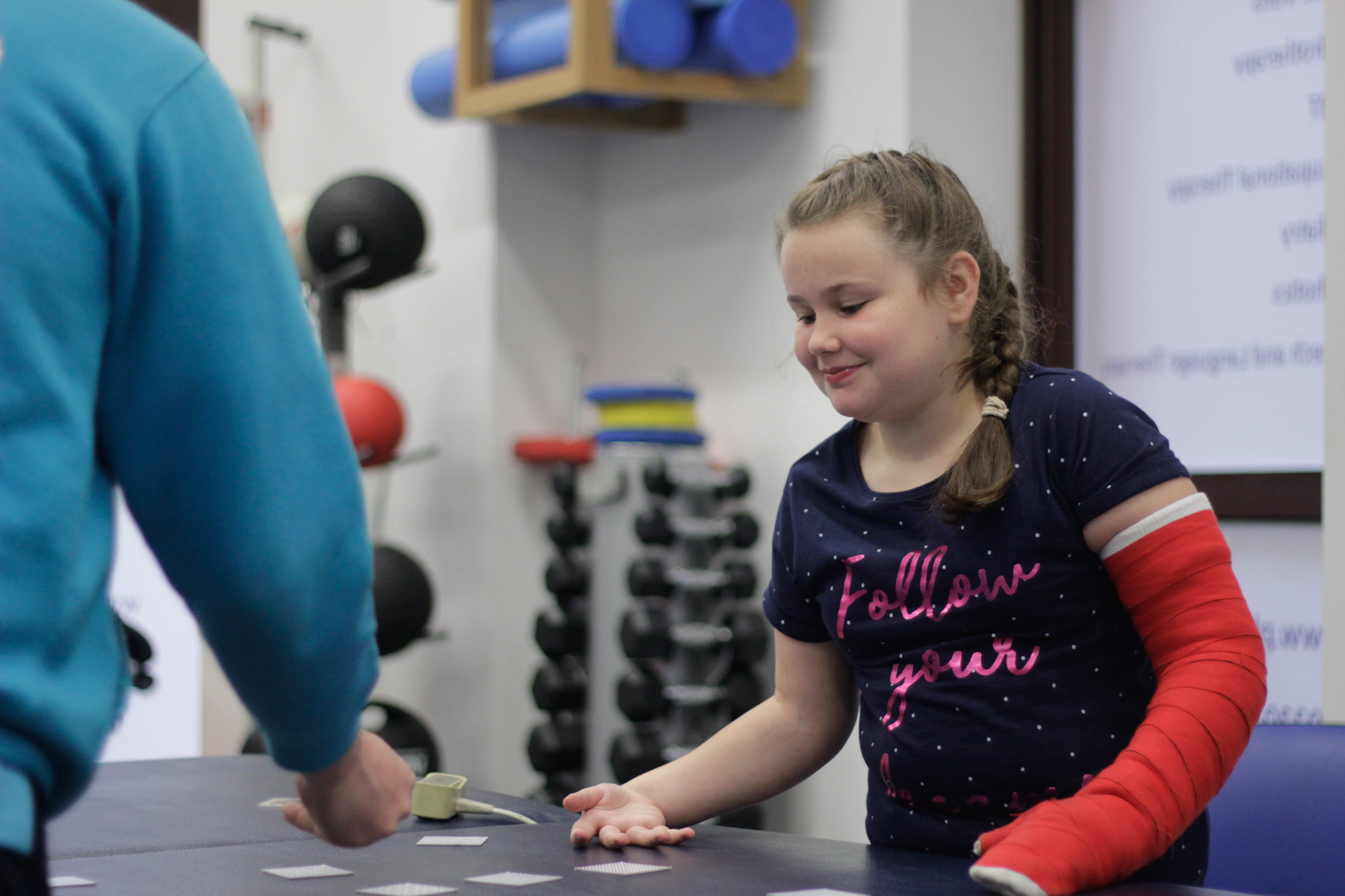 Katie playing with toys during CIMT treatment