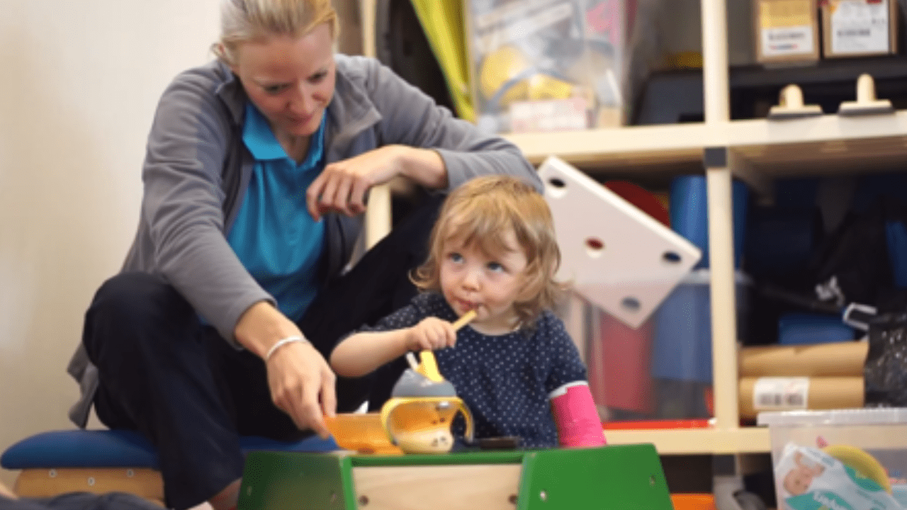 Lottie eating and using utensils.