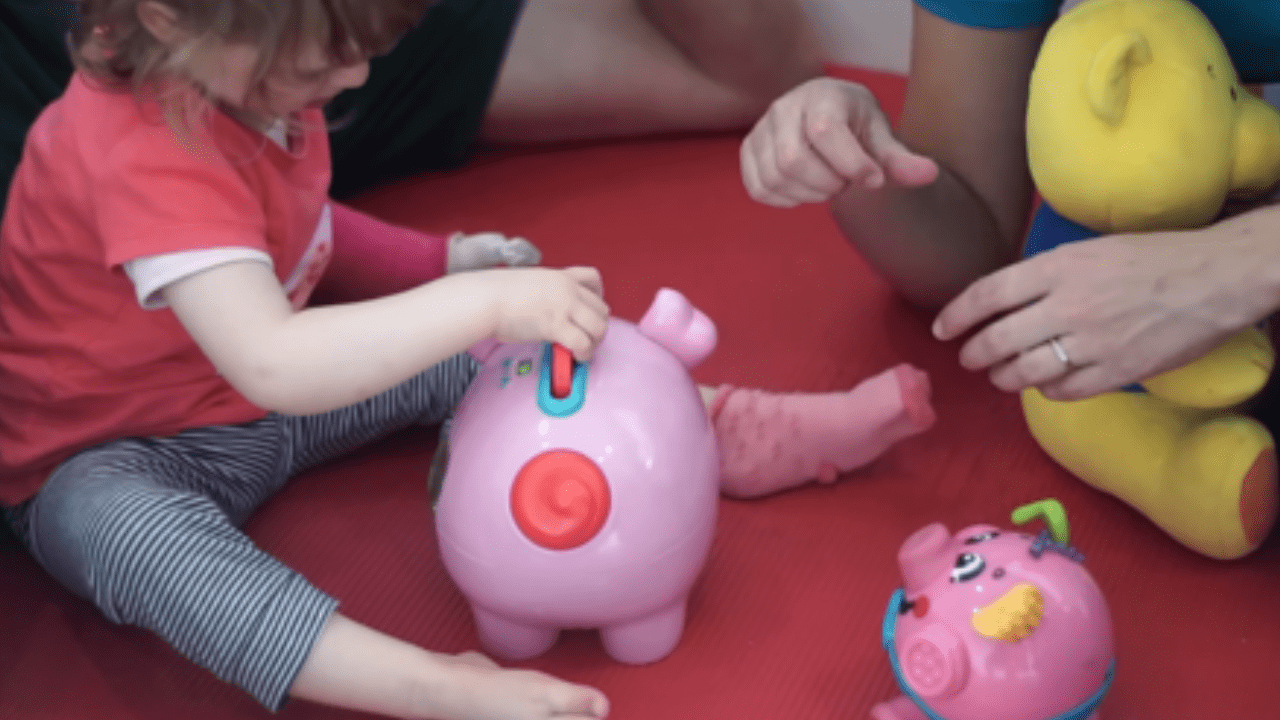 Lottie playing during her therapy.