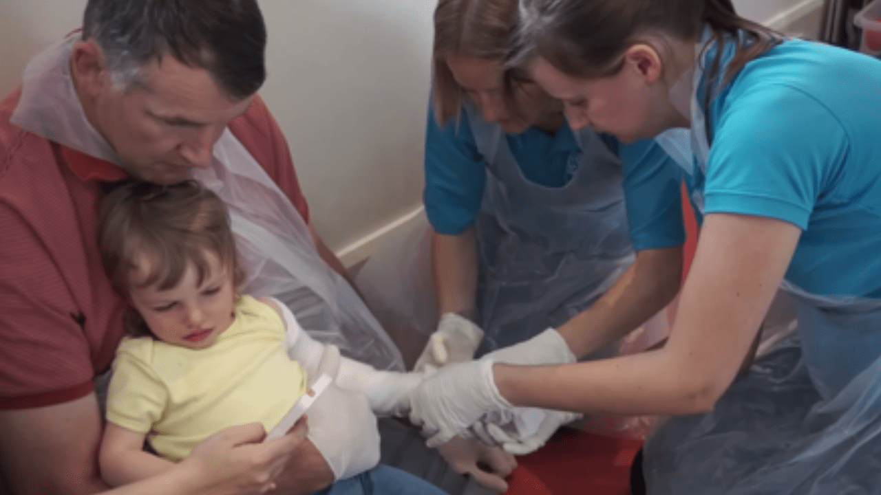 Lottie having her cast applied at the start of her treatment.