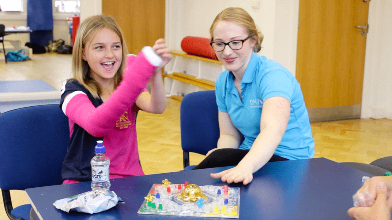 Lydia celebrates during treatment success.