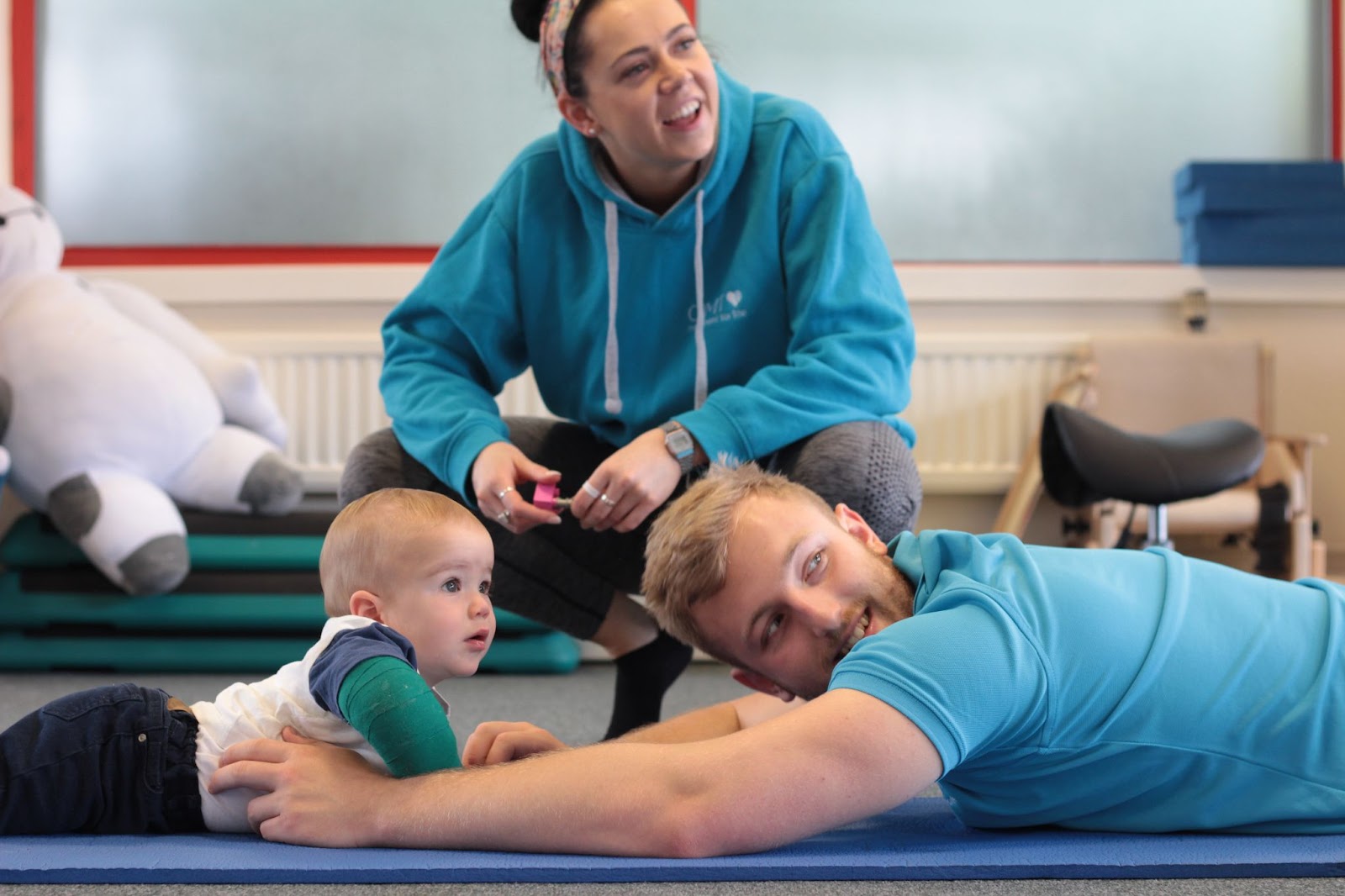 Close up of Myles with his CIMT therapists.