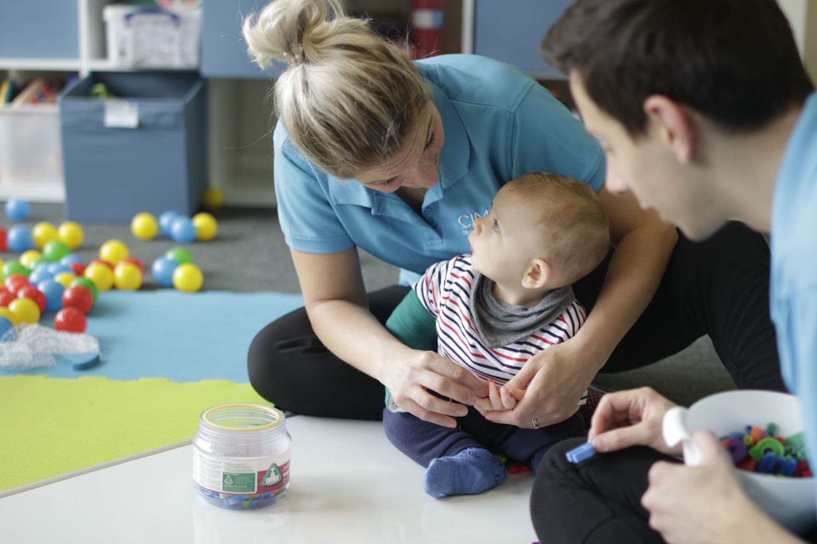 Noah with his CIMT therapists