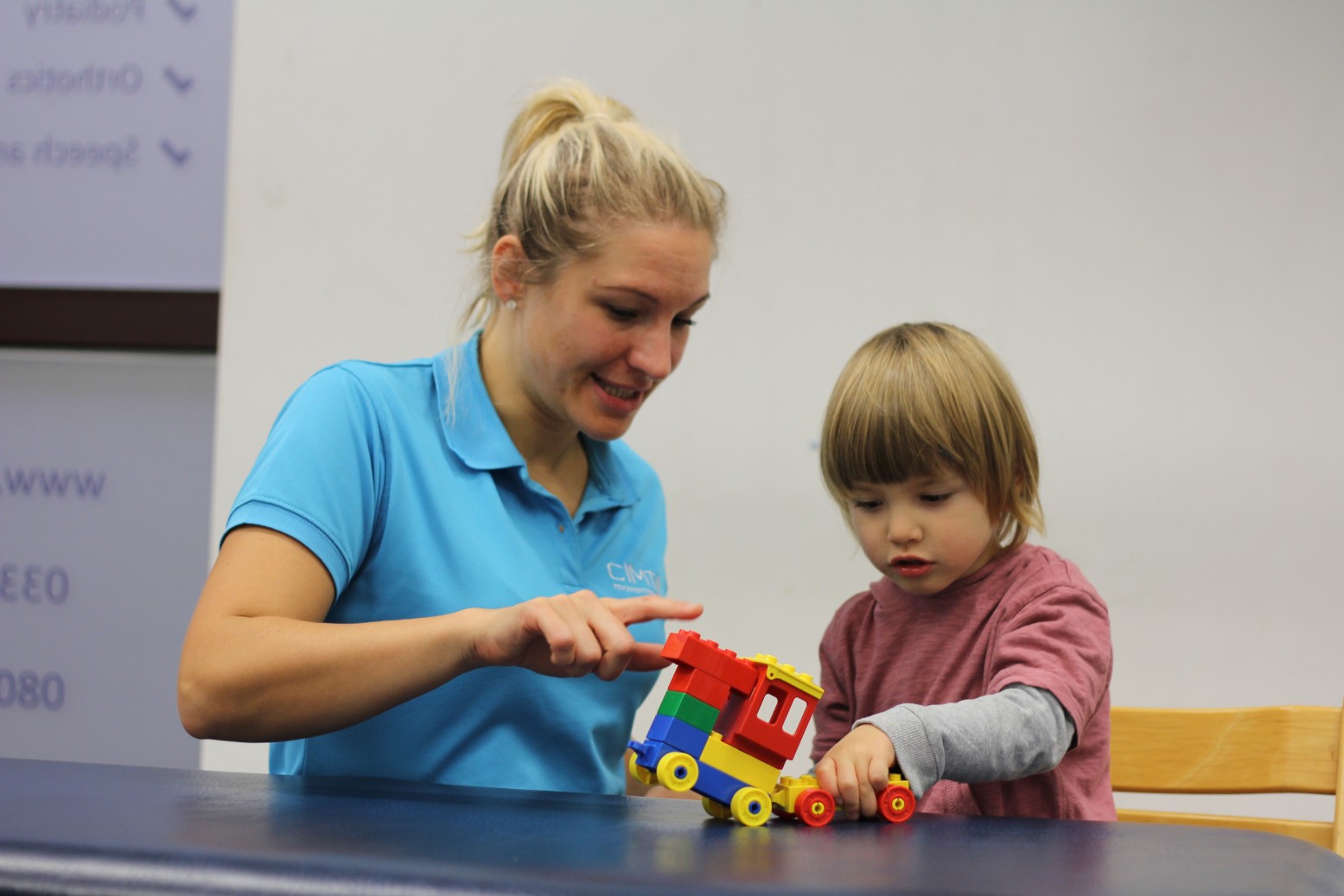 Reggie playing with lego during CIMT treatment.