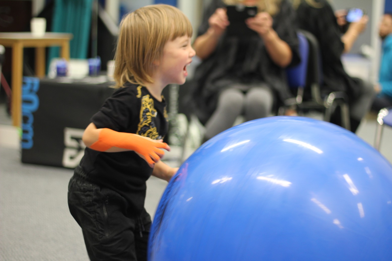 Reggie playing with toys during CIMT treatment.