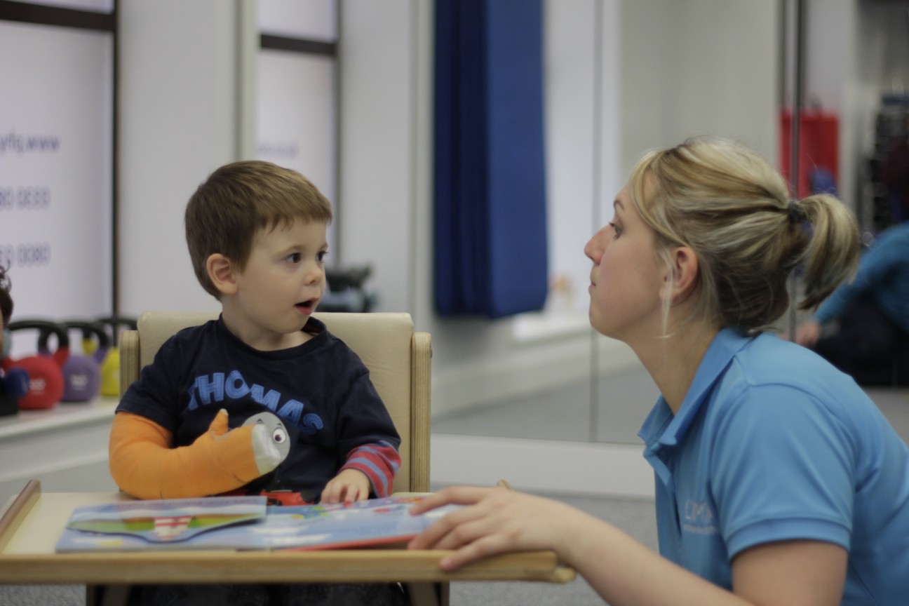 Thomas excited about playing with CIMT therapists.